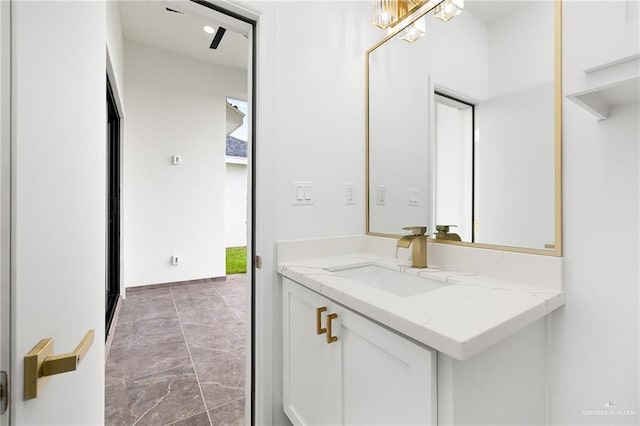 900 N Trinity St, Edinburg, TX 78541 - bathroom featuring vanity and marble look tile flooring