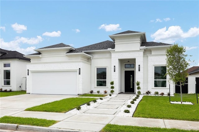 900 N Trinity St, Edinburg, TX 78541 - prairie-style house with a front lawn, an attached garage, stucco siding, and driveway