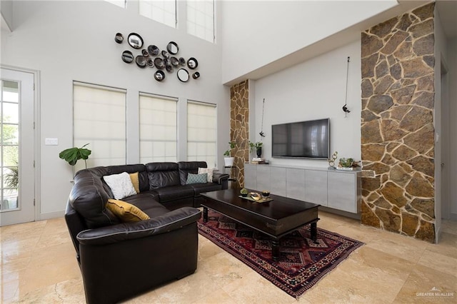 living room with a towering ceiling