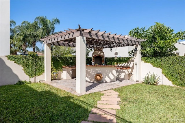 view of patio / terrace featuring a pergola and a fireplace