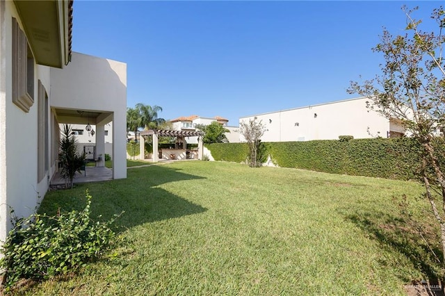 view of yard with a pergola and a patio