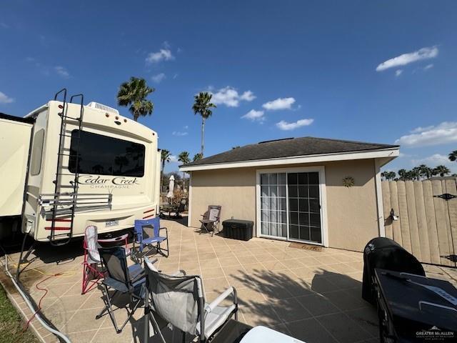 rear view of house with a patio