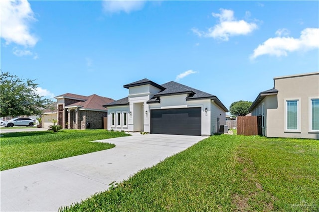 2229 N Ruby St, Edinburg, TX 78541 - prairie-style home featuring a garage, driveway, and stucco siding
