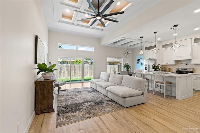 2229 N Ruby St, Edinburg, TX 78541 - living room featuring beam ceiling, light wood-type flooring, coffered ceiling, recessed lighting, and baseboards