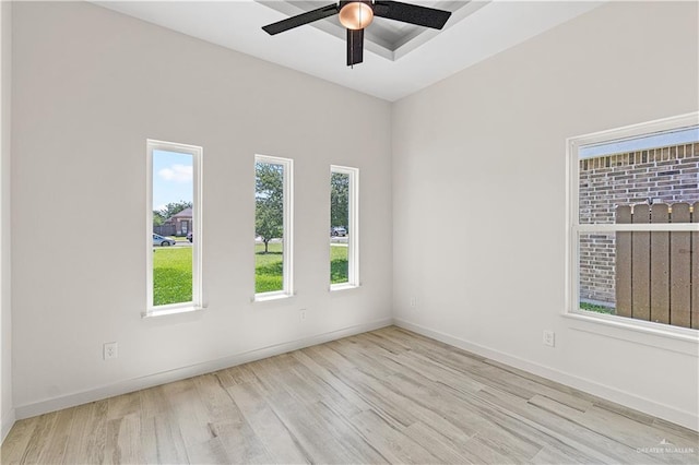 2229 N Ruby St, Edinburg, TX 78541 - unfurnished room with wood finished floors, plenty of natural light, a ceiling fan, and baseboards