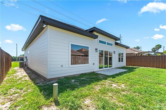 2229 N Ruby St, Edinburg, TX 78541 - rear view of property featuring central air condition unit