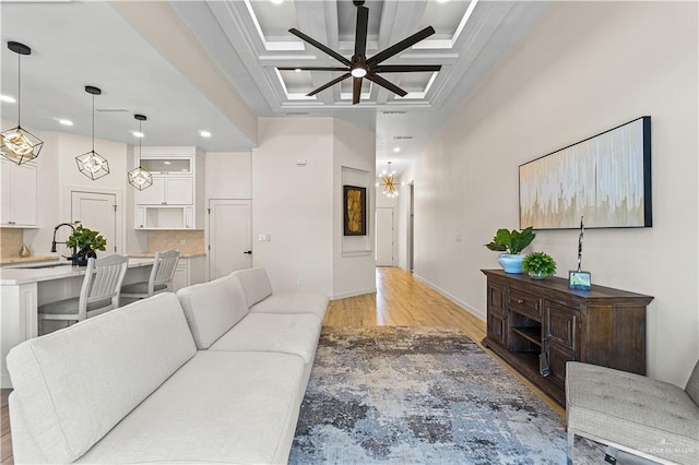 2229 N Ruby St, Edinburg, TX 78541 - living room featuring light wood-type flooring, recessed lighting, coffered ceiling, a ceiling fan, and baseboards