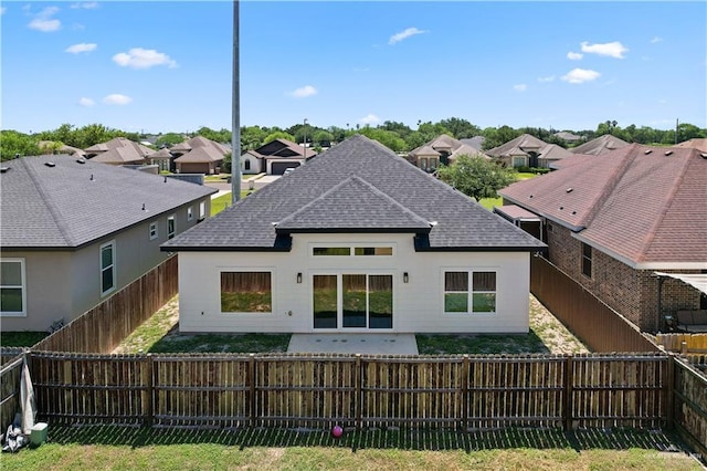 2229 N Ruby St, Edinburg, TX 78541 - rear view of house featuring roof with shingles, a fenced backyard, a patio area, and a residential view