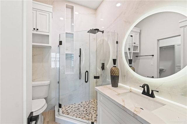 2229 N Ruby St, Edinburg, TX 78541 - bathroom featuring a shower stall, toilet, and vanity