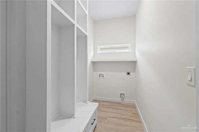 2229 N Ruby St, Edinburg, TX 78541 - clothes washing area featuring hookup for an electric dryer, washer hookup, light wood-type flooring, and baseboards
