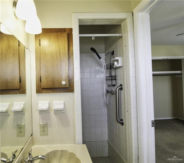 bathroom with a tile shower