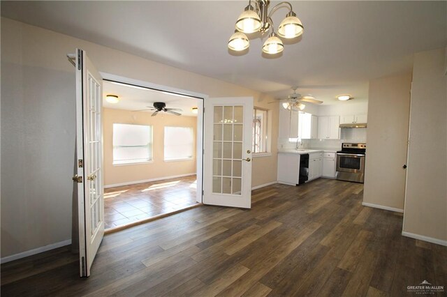 dining area featuring baseboards, a notable chandelier, visible vents, and wood finished floors