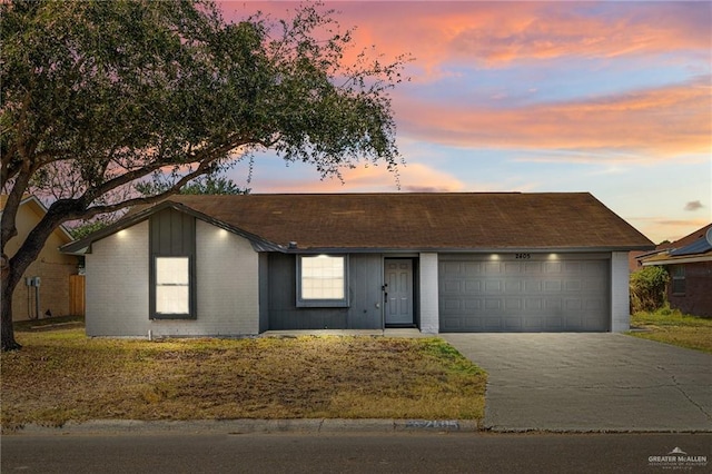 single story home featuring a garage