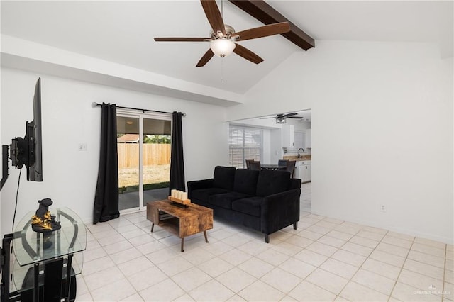 tiled living room featuring ceiling fan, vaulted ceiling with beams, and sink