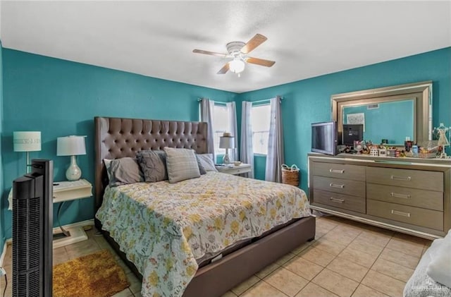 tiled bedroom featuring ceiling fan