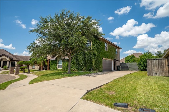 view of side of property featuring a lawn and a garage