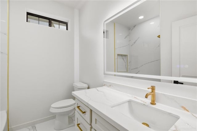 full bathroom with marble finish floor, vanity, a marble finish shower, and toilet