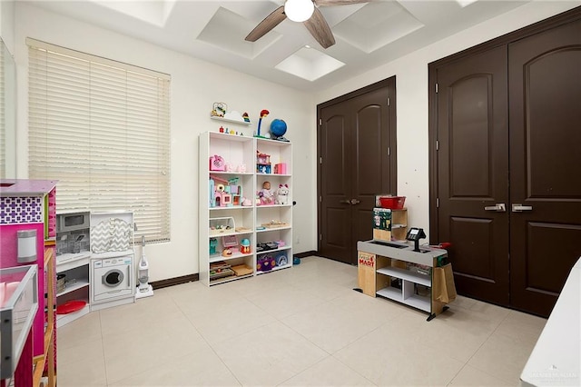 recreation room with light tile patterned floors and ceiling fan