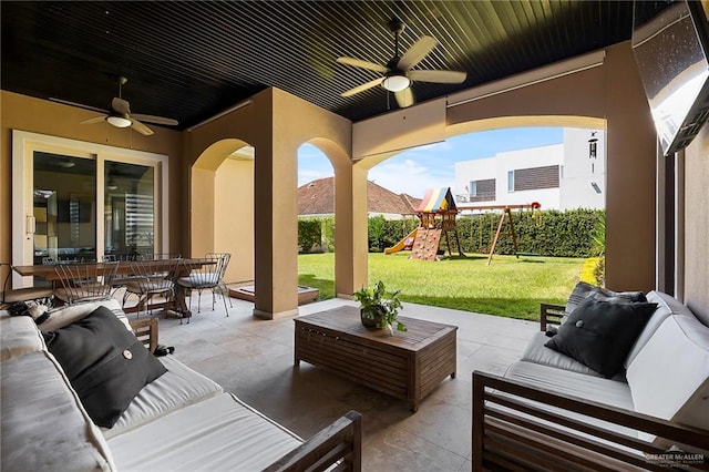 view of patio / terrace with a playground, ceiling fan, and an outdoor hangout area