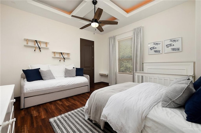 bedroom with ceiling fan, beamed ceiling, and dark hardwood / wood-style floors