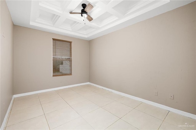 spare room featuring beamed ceiling, baseboards, coffered ceiling, and ceiling fan