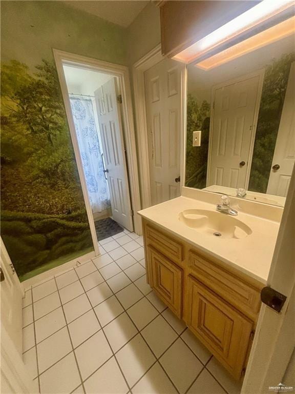 3713 Gonzalez Ln, Mcallen, TX 78504 - bathroom featuring tile patterned flooring, vanity, and wallpapered walls