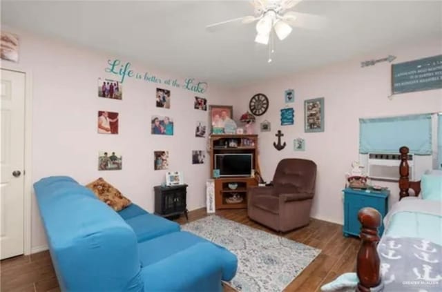 living room with dark hardwood / wood-style floors and ceiling fan