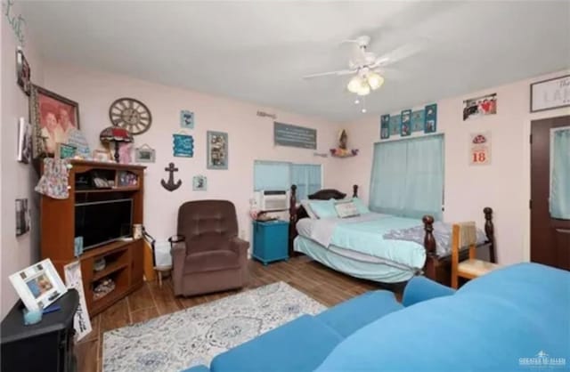 bedroom with hardwood / wood-style flooring and ceiling fan