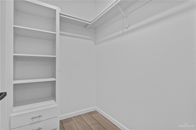 205 Faith Dr, La Feria, TX 78559 - spacious closet featuring wood finished floors