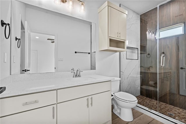 205 Faith Dr, La Feria, TX 78559 - full bathroom featuring vanity, toilet, and a shower stall