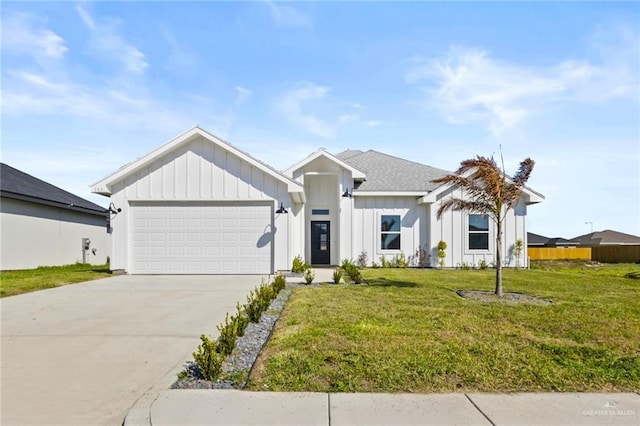 modern farmhouse style home with a garage and a front lawn