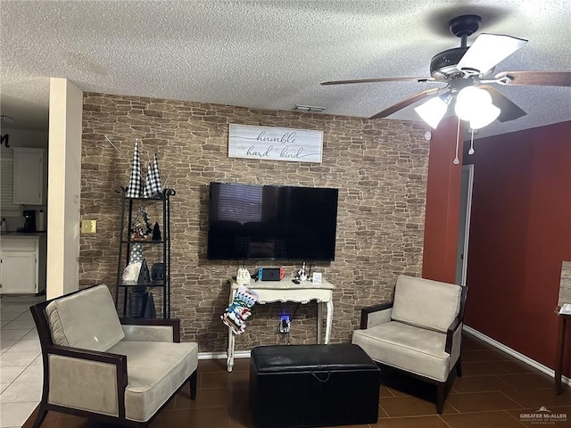 2104 Fairmont Ave, Mcallen, TX 78504 - tiled living room featuring a textured ceiling and ceiling fan