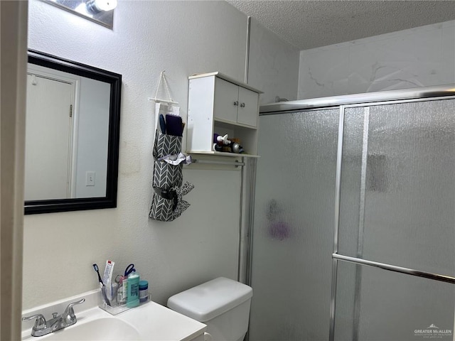 2104 Fairmont Ave, Mcallen, TX 78504 - full bathroom featuring a shower with shower door, vanity, and a textured ceiling