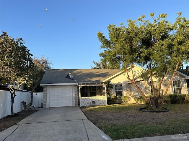 ranch-style home featuring a garage