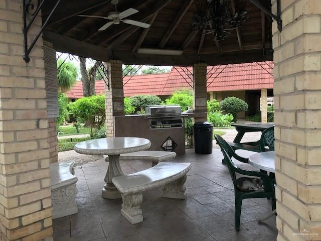 view of patio with a gazebo, ceiling fan, and area for grilling