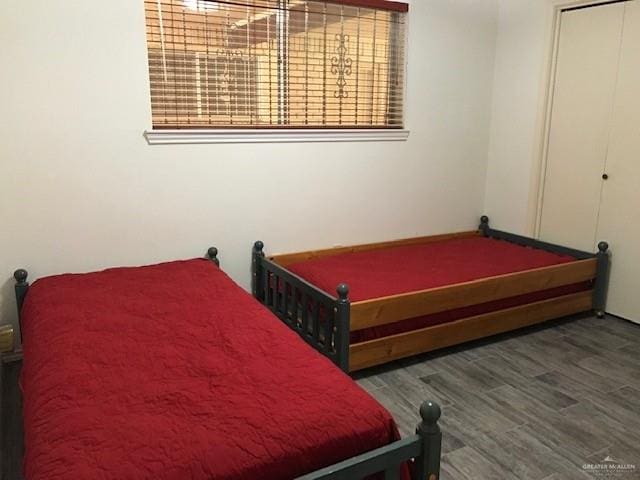 bedroom featuring dark wood-type flooring