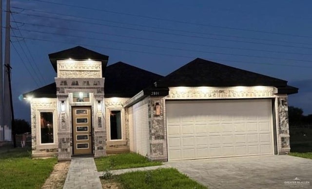 view of front of home with a garage