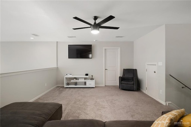 living room featuring ceiling fan and light carpet