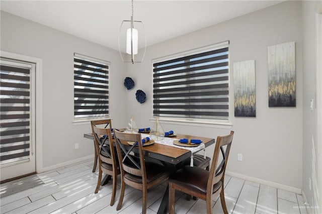 dining space with light wood-type flooring