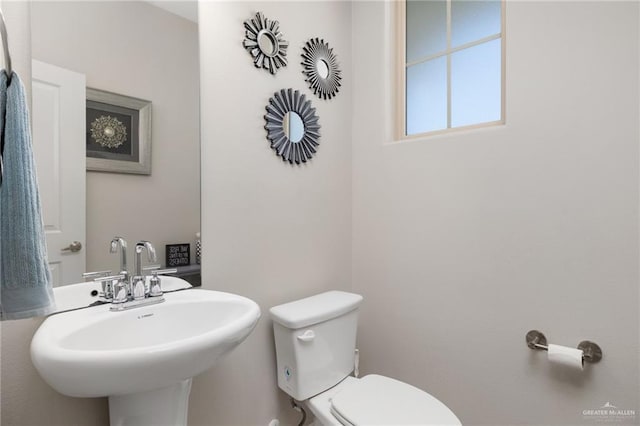 bathroom featuring sink and toilet