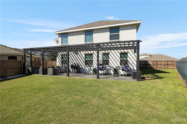 rear view of property with a pergola, a patio area, and a lawn