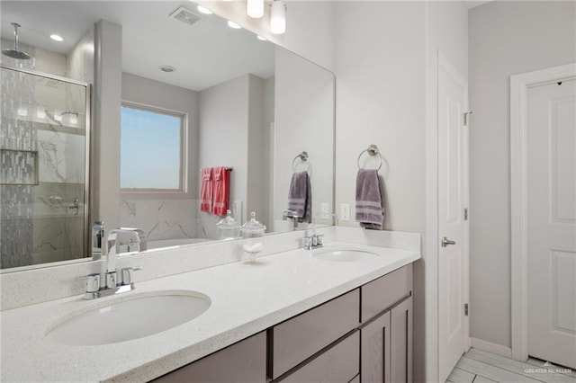 bathroom featuring vanity and walk in shower