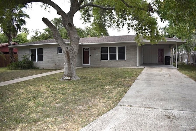 ranch-style house with a carport and a front lawn