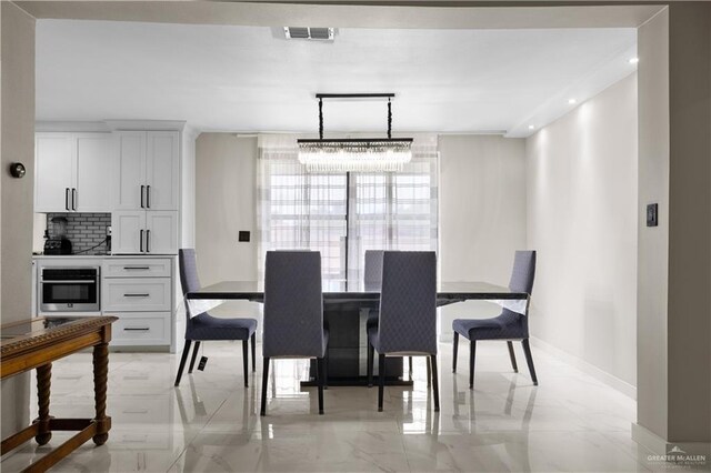 1201 S Danner Rd, Pharr, TX 78577 - dining area with light marble finish flooring and recessed lighting
