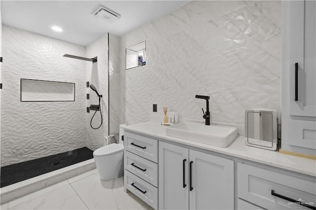 1201 S Danner Rd, Pharr, TX 78577 - full bathroom with a tile shower, vanity, and marble finish flooring