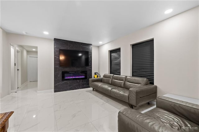 1201 S Danner Rd, Pharr, TX 78577 - living room featuring recessed lighting, marble finish floors, and a high end fireplace