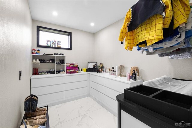 1201 S Danner Rd, Pharr, TX 78577 - bathroom with marble look tile flooring and recessed lighting