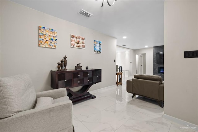 1201 S Danner Rd, Pharr, TX 78577 - living room with light marble finish floors, recessed lighting, and a fireplace