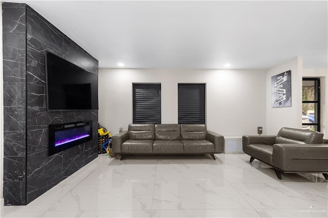 1201 S Danner Rd, Pharr, TX 78577 - living area featuring marble finish flooring, a premium fireplace, and recessed lighting
