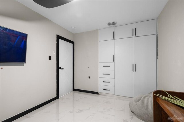 1201 S Danner Rd, Pharr, TX 78577 - bedroom featuring light marble finish flooring and a closet